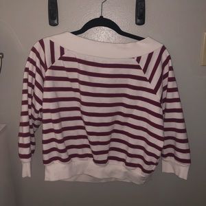 White, blue, and red striped sweater.